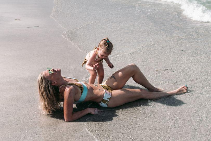 Building sandcastles on mommy - 1 of 2