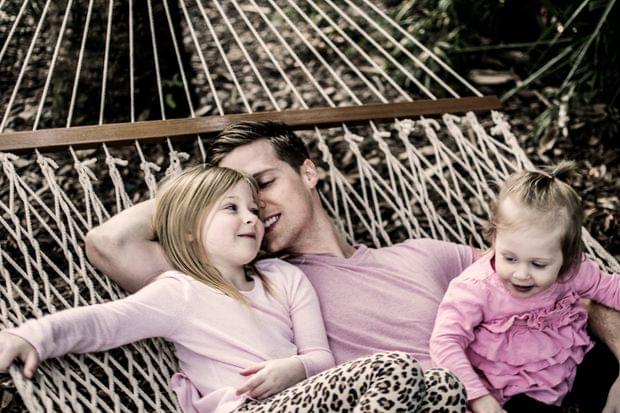 Cadence, David, and Jemma swinging on a hammock